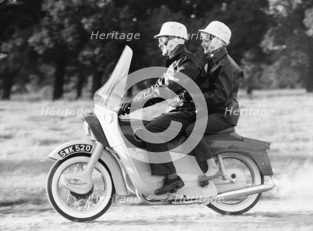 A man and a woman riding an Ariel Leader, 1958. Artist: Unknown