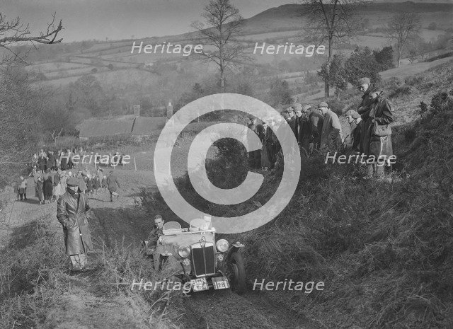 MG PB of K Scales competing in the MG Car Club Midland Centre Trial, 1938. Artist: Bill Brunell.