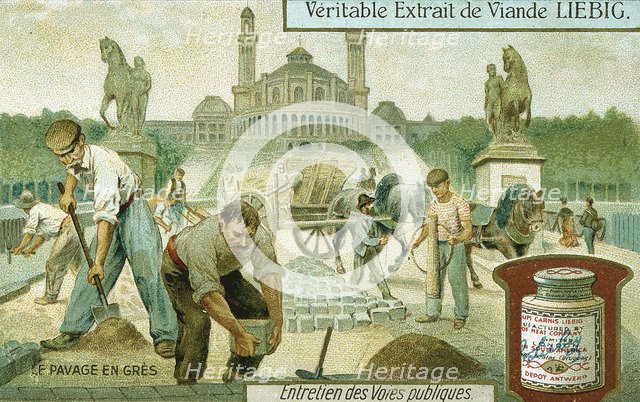 Surfacing a road with granite setts, Paris, c1900. Artist: Unknown