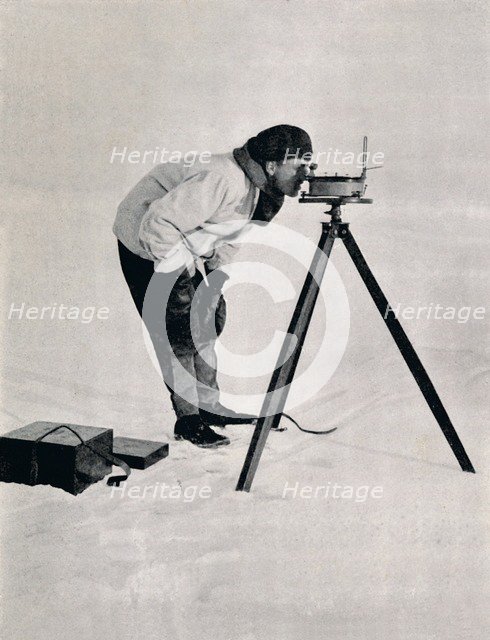 'Lieut. Pennell with a Prismatic Compass', December 1910, (1913). Artist: Herbert Ponting.