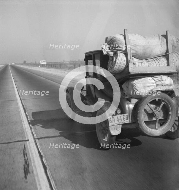 Drought refugee's car on U.S. Highway 99 between Bakersfield and Famoso, California, 1936. Creator: Dorothea Lange.