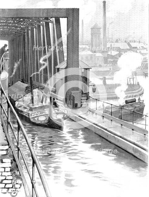 Water spanned by water: the Bridgewater Canal crossing the Manchester Ship Canal, 1909. Creator: Samuel Begg.