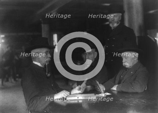 Old veterans playing cribbage at Soldiers' Home, Washington, D.C., ca. 1900, c1900. Creator: Frances Benjamin Johnston.