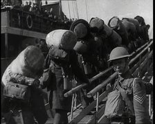 Male British Expeditionary Force Solders With Their Packs Walking up a Gangplank Past..., 1939. Creator: British Pathe Ltd.