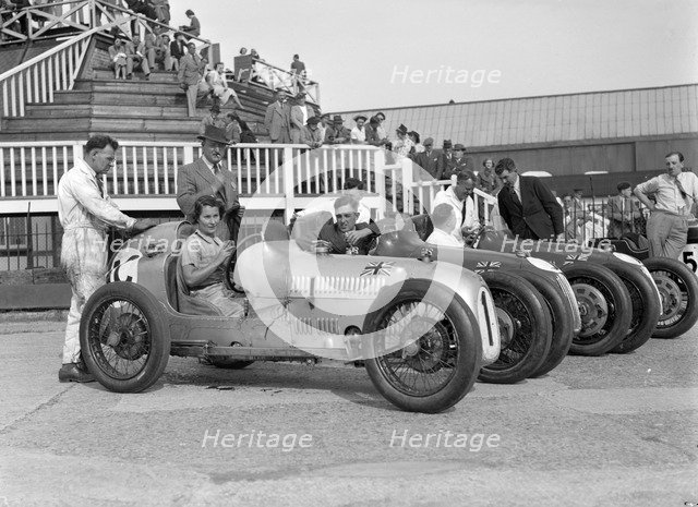 Austin 7 works team, Brooklands 1937. Artist: Bill Brunell.