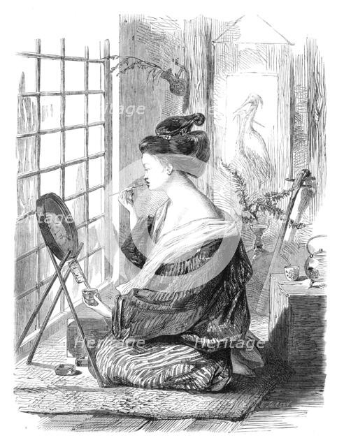 Japanese girl painting her lips, 1864. Creator: Mason Jackson.