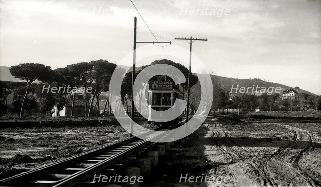 Argentona Mataró Tram crossing the pontoon on the river of Argentona, on a postcard of the 1920.