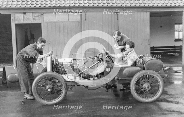 Amherst Villiers and a mechanic taking the revs of a Bugatti Cordon Rouge, c1920s. Artist: Unknown