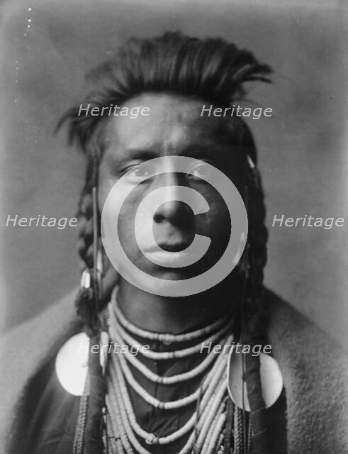 Lies Sideway, c1908. Creator: Edward Sheriff Curtis.