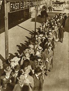 Passengers waiting at Goldhawk Road Station in London during the railway strike, 1919, (1935). Creator: Unknown.