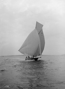 The 8 Metre class 'Antwerpia IV' sailing under spinnaker, 1912. Creator: Kirk & Sons of Cowes.