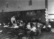 Children in school in Washington, D.C. - studying mathematics, (1899?). Creator: Frances Benjamin Johnston.