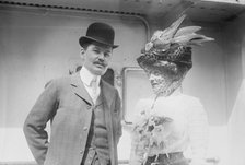 Mr. and Mrs. C.F. Bishop next to train, 1910. Creator: Bain News Service.