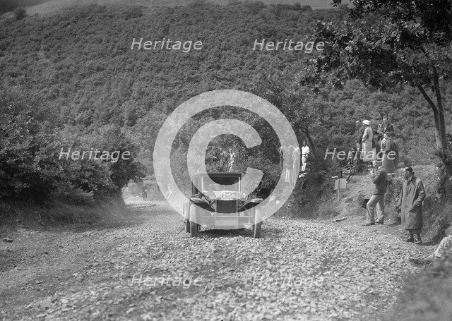 Lancia Lambda saloon competing in the Mid Surrey AC Barnstaple Trial, Beggars Roost, Devon, 1934. Artist: Bill Brunell.