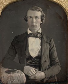 Seated Young Man Resting Arm on Table Beside Daguerreotype Case, 1840s. Creator: Unknown.