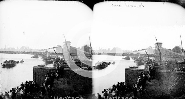 River Thames on University Boat Race day, Hammersmith, London, c1870-1883. Artist: York & Son