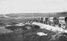 'Au Volant; Sur une route strategique, a proximite de la ligne de feu: releve de troupes par...,1918 Creator: Unknown.