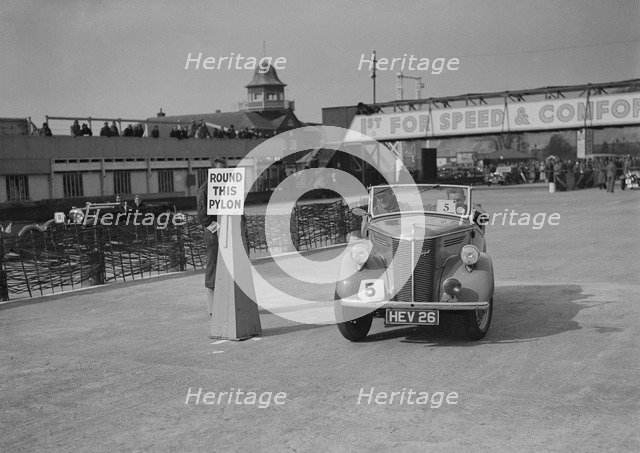 Ford Prefect tourer competing in the JCC Rally, Brooklands, Surrey, 1939. Artist: Bill Brunell.