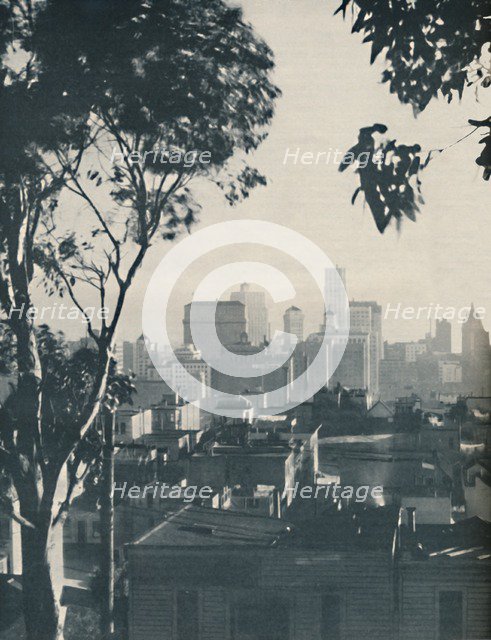 'Dwellings of Homely Timber in the Shadow of Concrete Giants', c1935. Artist: Unknown.