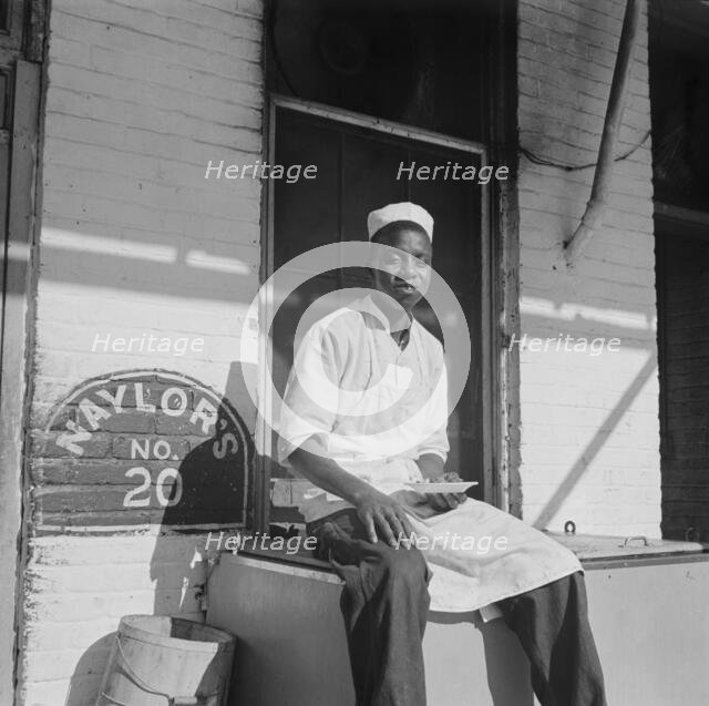 A dishwasher who works in a waterfront restaurant, Washington, D.C., 1942. Creator: Gordon Parks.