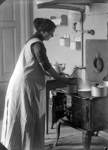 The photographer's wife in the kitchen, Landskrona, Sweden, 1910. Artist: Unknown