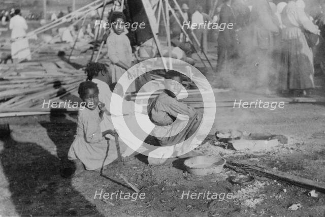 Louisiana Flood - refugees cook government rations, 1912. Creator: Bain News Service.