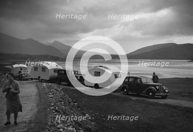 Group of cars and caravans camping in Scottish Highlands 1930's. Creator: Unknown.