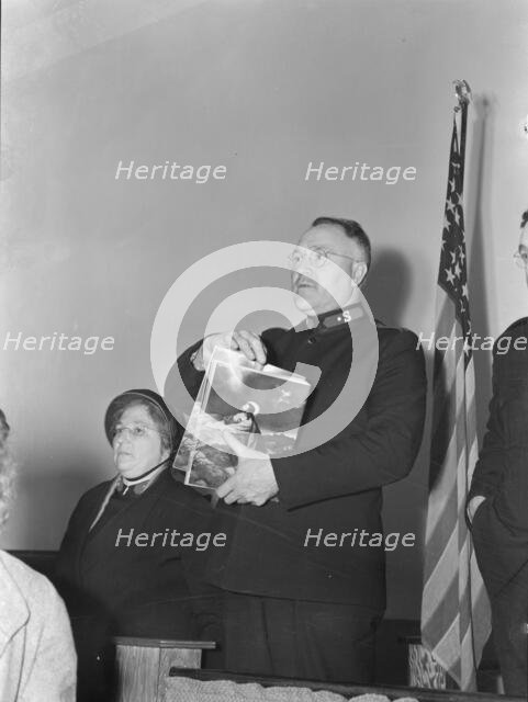 Selling Easter edition of the "War Cry", Salvation army, San Francisco, California, 1939. Creator: Dorothea Lange.