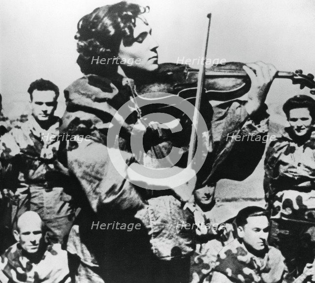 Russian army nurse playing a violin, Eastern Front, 1944. Artist: Unknown