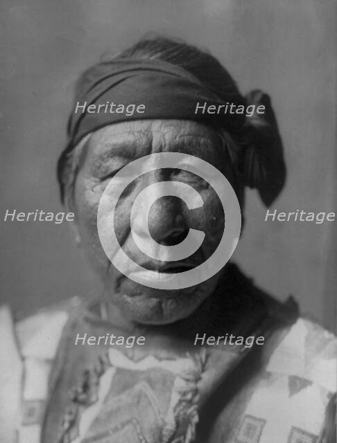 Sitting Owl-Hidatsa, c1908. Creator: Edward Sheriff Curtis.