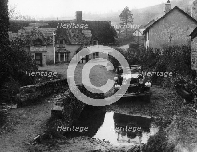 Kitty Brunell at the wheel of a Ford Model A, Winsford, Somerset, 1930. Artist: Unknown