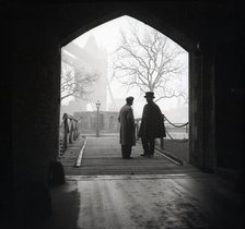 Yeoman Warder and visitor, Tower of London, c1955. Creator: Arthur Charles Kirby Ware.