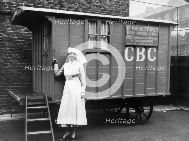 Nurse outside a Marie Stopes mobile birth control clinic, London, 1928. Creator: Unknown.