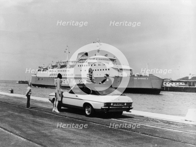 A 1974 Ford Capri on a quay, in front of a Townsend Thoresen car ferry, 1970s. Artist: Unknown