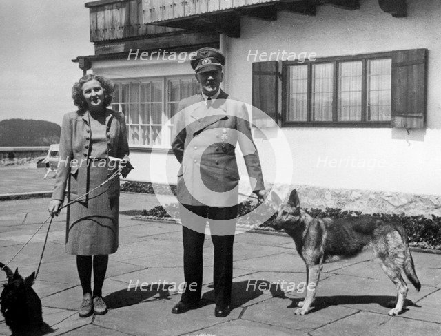 Eva Braun and Adolf Hitler, with their two dogs Wulf and Blondi at the Berghof, 1942.