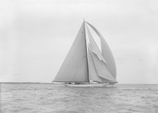 The 23-metre cutter 'Astra' sailing with spinnaker.  Creator: Kirk & Sons of Cowes.