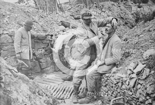 French trench barber, between c1915 and 1918. Creator: Bain News Service.