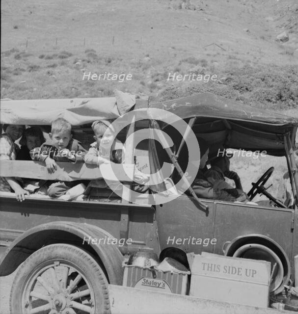 Family of drought refugees on US 99 near Bakersfield, California, 1937. Creator: Dorothea Lange.