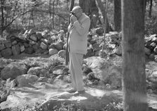 Rothbart, Albert, Mr., taking a photograph outdoors, between 1920 and 1935. Creator: Arnold Genthe.