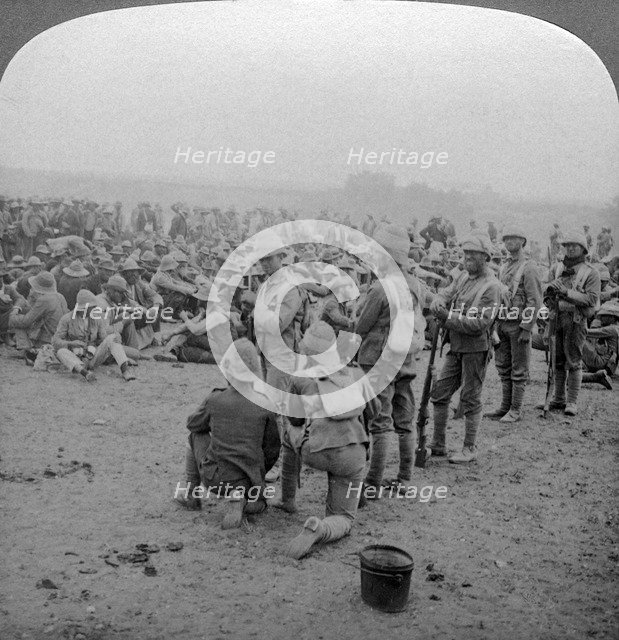 Boer prisoners resting on the road from Paardeberg to Modder River, South Africa, 1900-1902.Artist: Underwood & Underwood