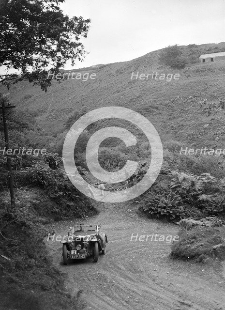 1935 MG PA taking part in a motoring trial in Devon, late 1930s. Artist: Bill Brunell.