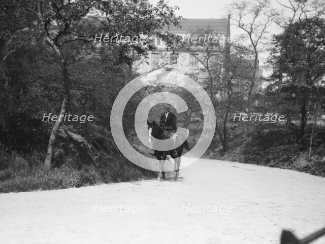 Arnold Genthe riding Chesty, between 1911 and 1936. Creator: Arnold Genthe.