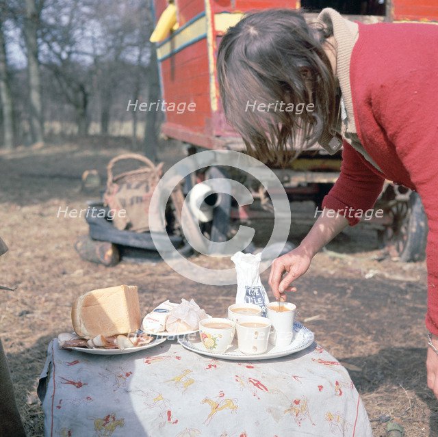 Gipsy woman making tea, Charlwood, Newdigate area, Surrey, 1964. 