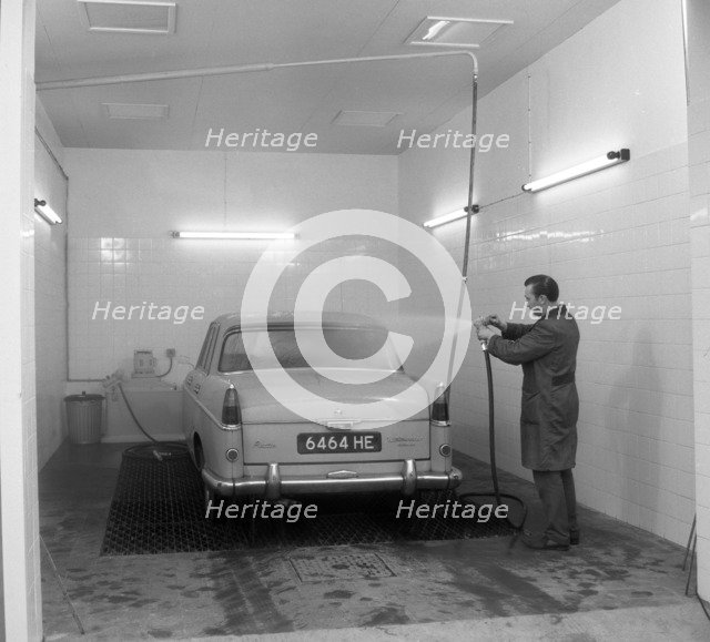 A 1961 Austin Westminster in a car wash, Grimsby, 1965.  Artist: Michael Walters