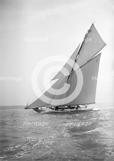 The 40-rater cutter 'Carina' sailing close-hauled, 1911. Creator: Kirk & Sons of Cowes.