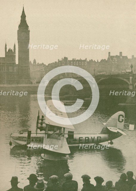 'The 'Calcutta' Flying-Boat Moored in the Thames opposite the Houses of Parliament', 1927. Artist: Unknown.