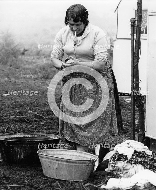 Gypsy woman washing clothes, 1960s.