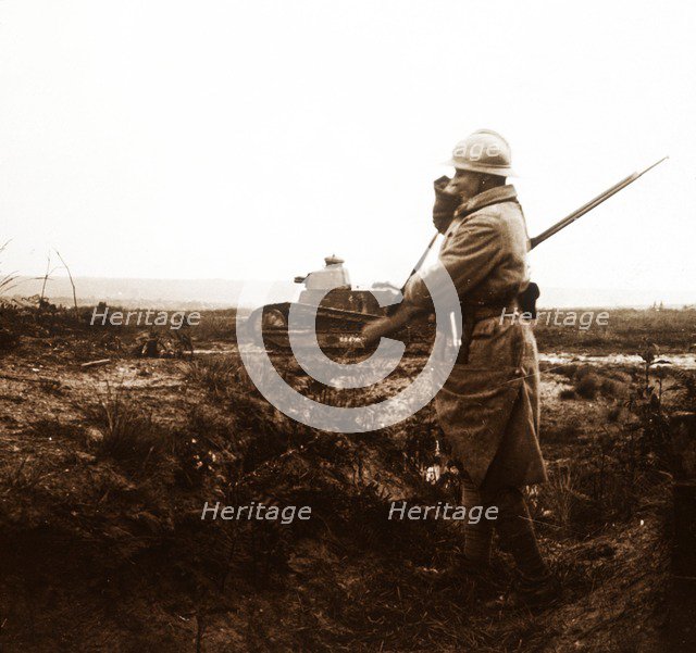 Tank and soldier on battlefield, c1914-c1918. Artist: Unknown.