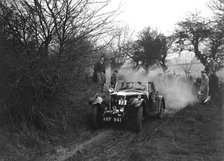 Riley of C Beddow at the Sunbac Colmore Trial, near Winchcombe, Gloucestershire, 1934. Artist: Bill Brunell.