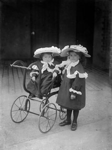Two children and a pram, c1896-c1920. Artist: Alfred Newton & Sons